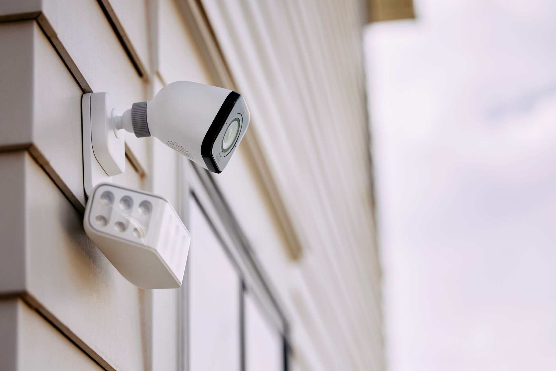 Spotlight outdoor security camera with active motion tracking and high lumen deterrence illumination